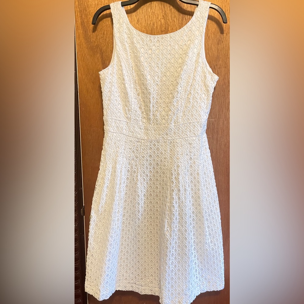 Pretty, white knee length dress. Fit and flare